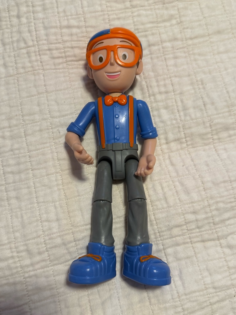 Blippi Feature Talking Figure, a 9-inch articulated toy produced by Jazwares.